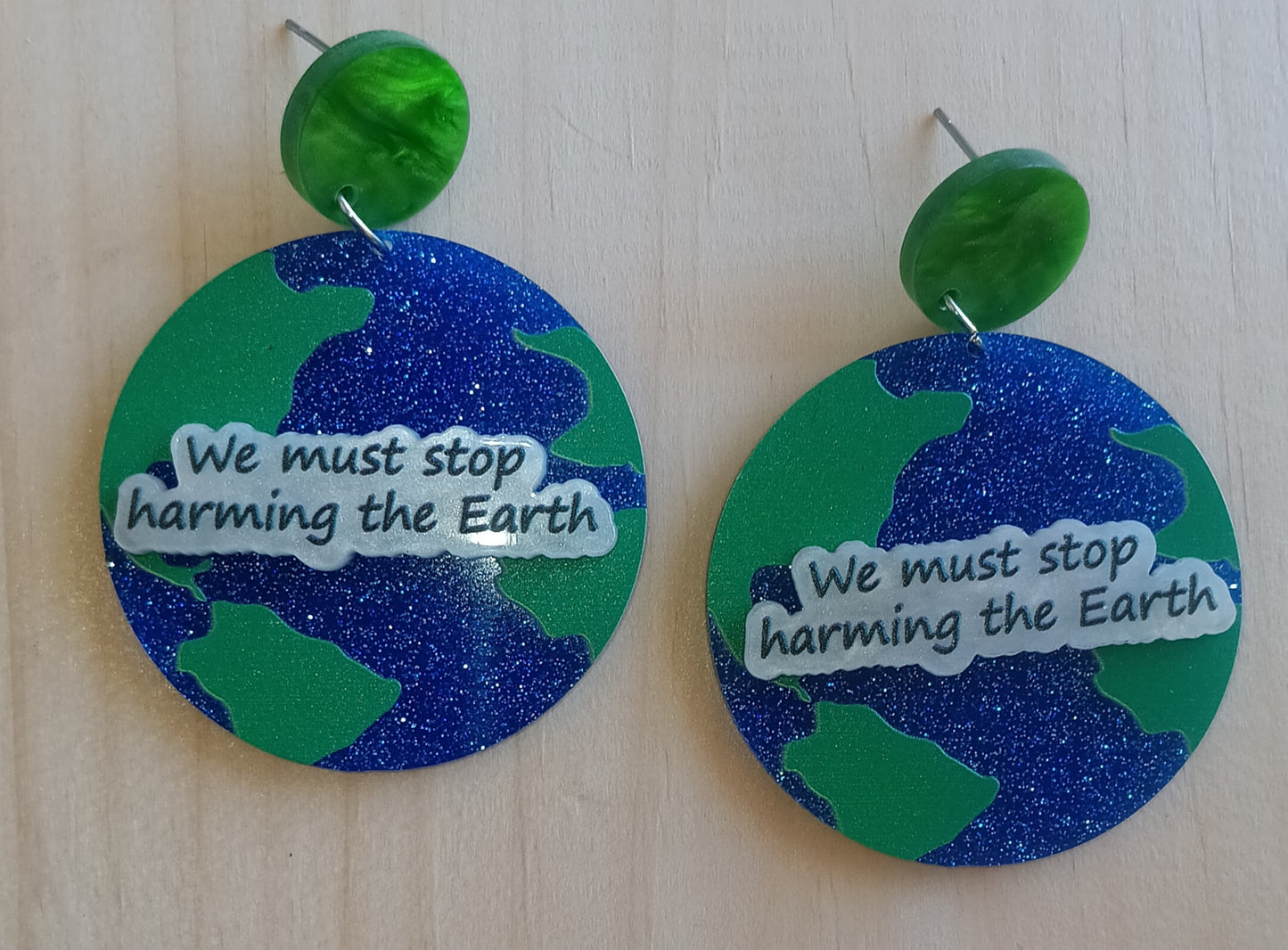 We must stop harming the Earth Earrings